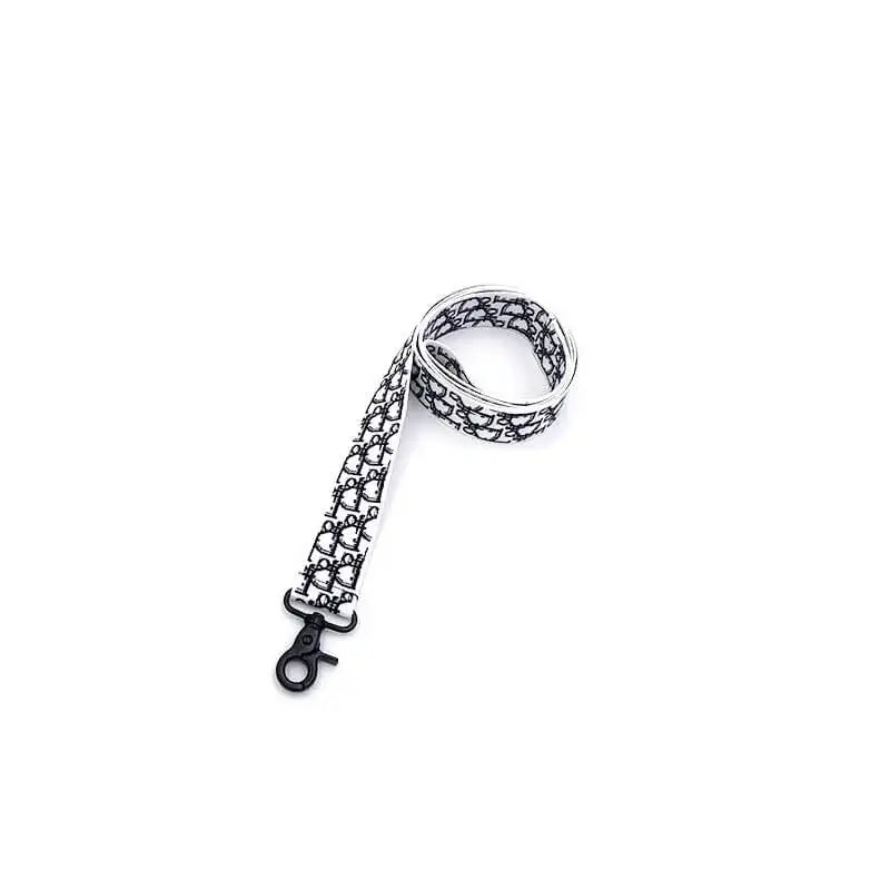 Black and white monogram pattern dog leash for French Bulldogs, stylish printed walking lead with black metal clasp.