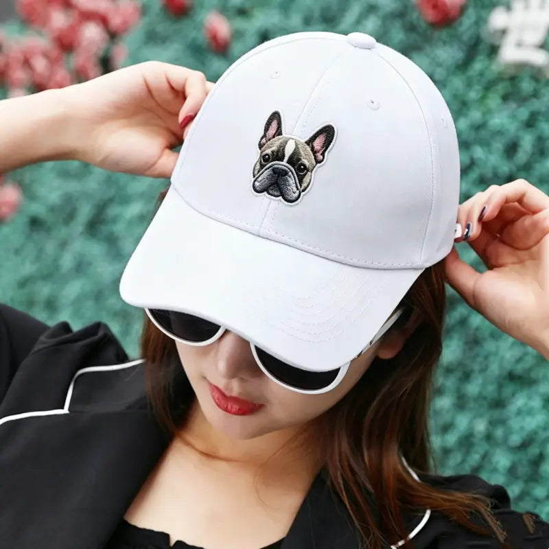 White cotton baseball cap with embroidered French Bulldog face, stylish Frenchie dad hat gift for French bulldog owners from FrenchieNest