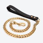 Full view of gold chain dog leash with black leather handle and stainless steel clasp
