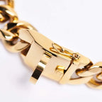 Close-up view of heavy-duty safety lock clasp on gold Cuban link dog collar, secure stainless steel buckle for strong pullers