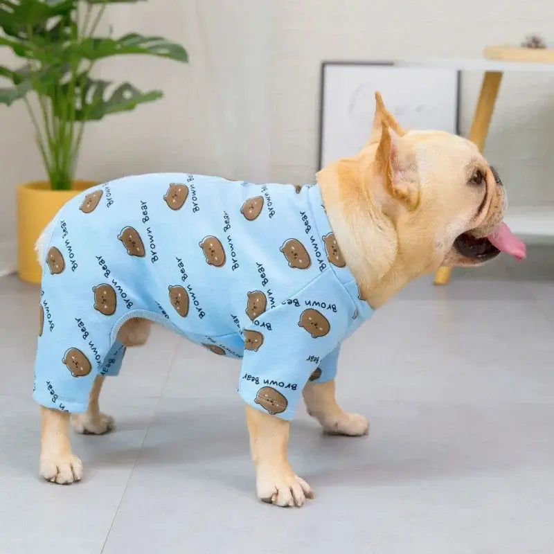 Fawn french bulldog wearing light blue brown bear print four legged pajamas indoor home wear for frenchie
