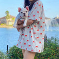 Matching French Bulldog and owner t-shirt set with red bulldog print, outdoor lifestyle photo