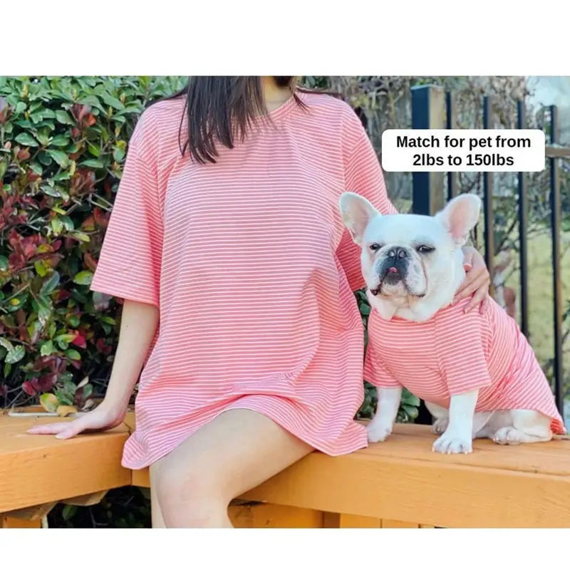Matching pink striped clothing set for owner and French Bulldog, showing the outfit fit and style for small to large pets.
