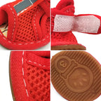 Close-up of red dog sandals for French Bulldogs, showing breathable mesh fabric, adjustable hook-and-loop strap, and anti-slip sole design.