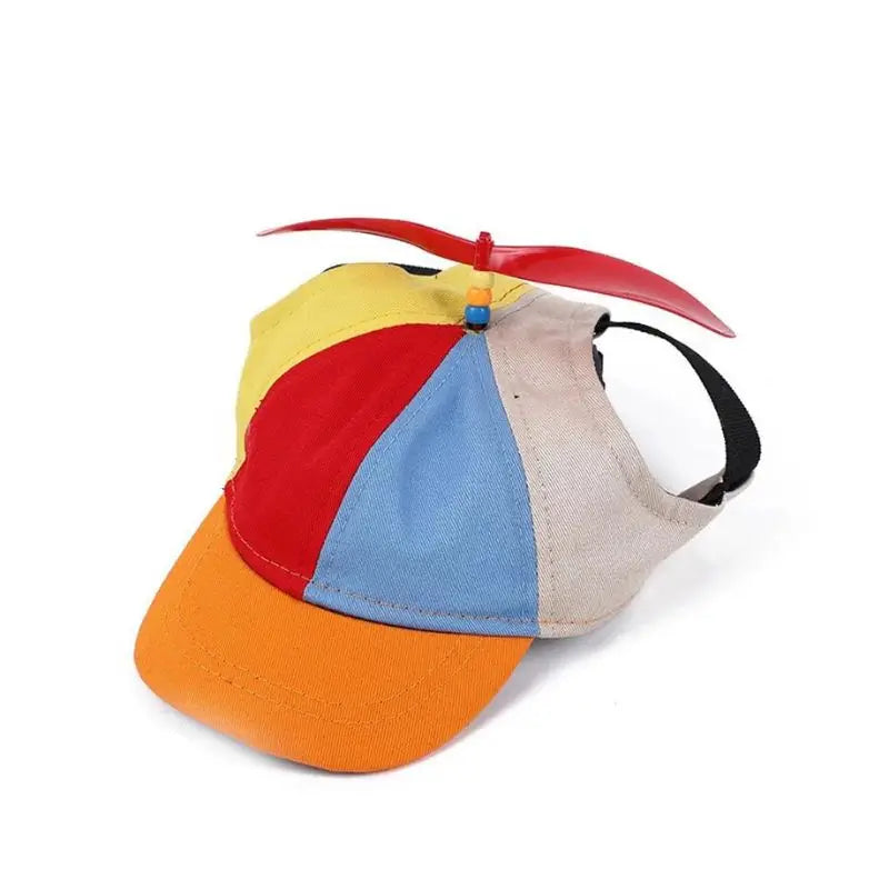 Red propeller pet hat with multicolor panels, funny sun cap for French Bulldogs