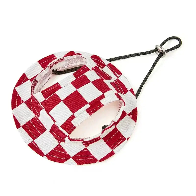 Adorable French Bulldog wearing black and white checkered pet hat, stylish sun protection accessory for small dogs