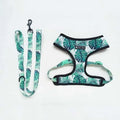 Tropical monstera leaf print dog harness and matching leash set for French Bulldogs, complete walking kit with adjustable straps.