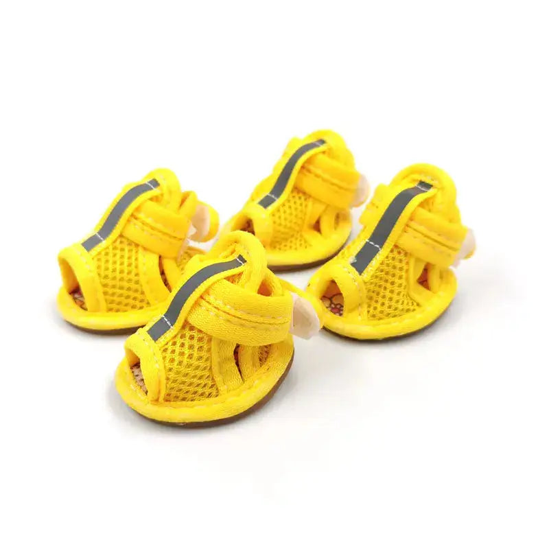 Yellow breathable mesh dog sandals for French Bulldogs, featuring adjustable reflective straps and non-slip soles for summer walks.