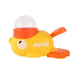 Yellow duck-shaped dog treat dispenser puzzle toy with foot pedal, non-electrical enrichment feeder for small breeds